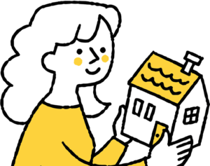 家の模型を持つ女性